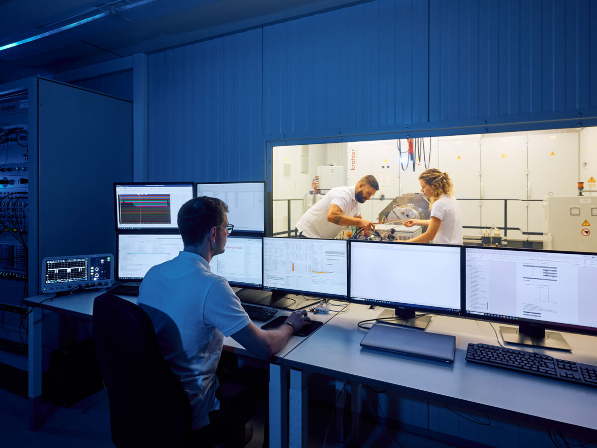 Employees at the e-machine test bench